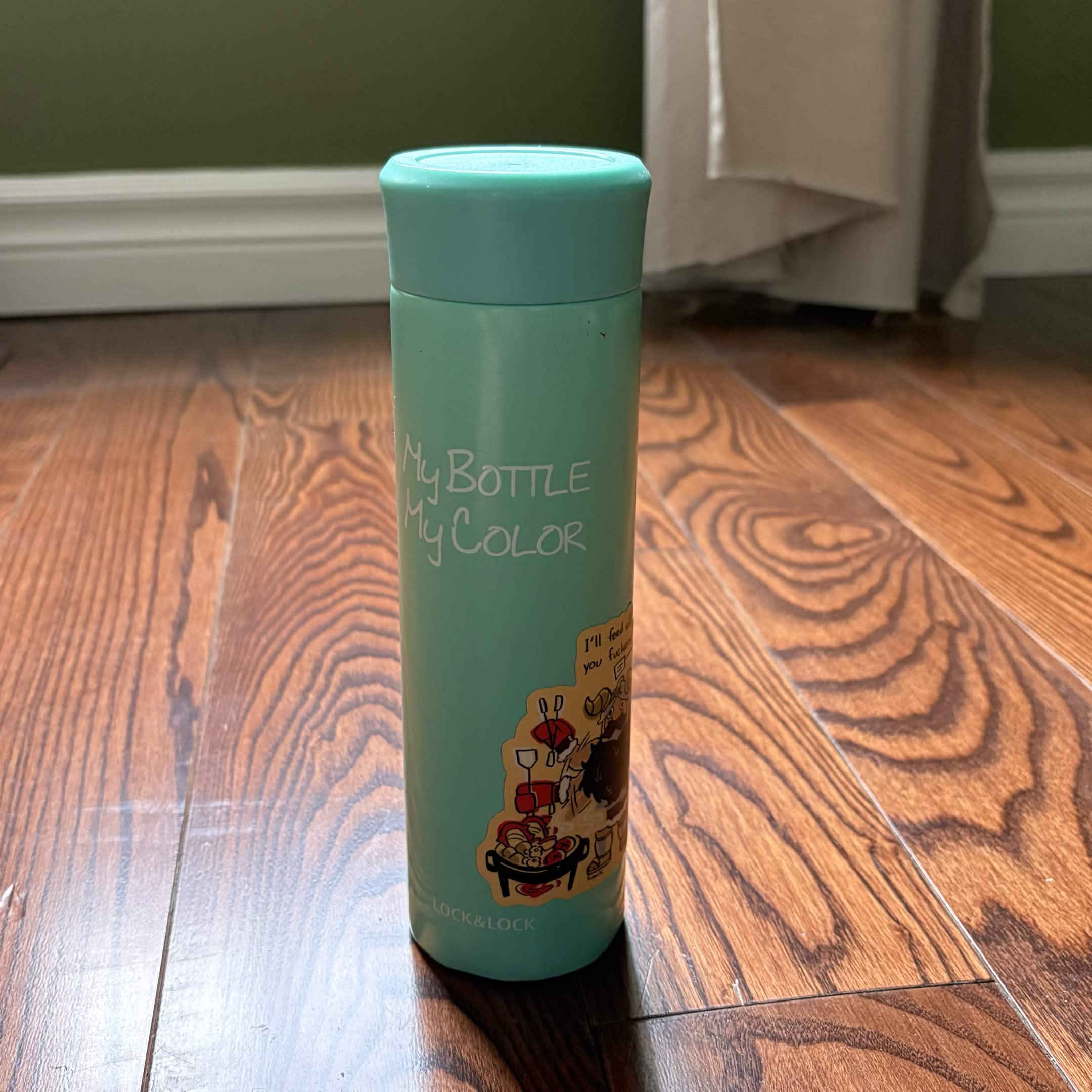 A cyan water bottle. I've been using it since grade 8. Survived all the moment of travel and dropping it into the ground. Very durable and good quality.