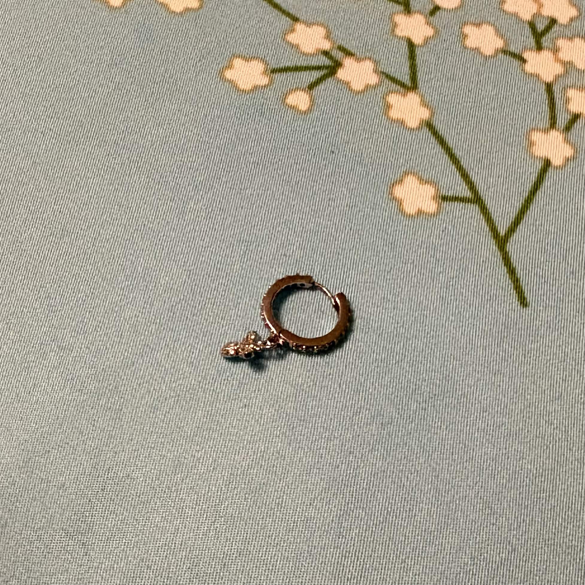 A piece of earing that I'm currently wearing and just took it off for the photo. Made out of titanium since I have sensitive ears
